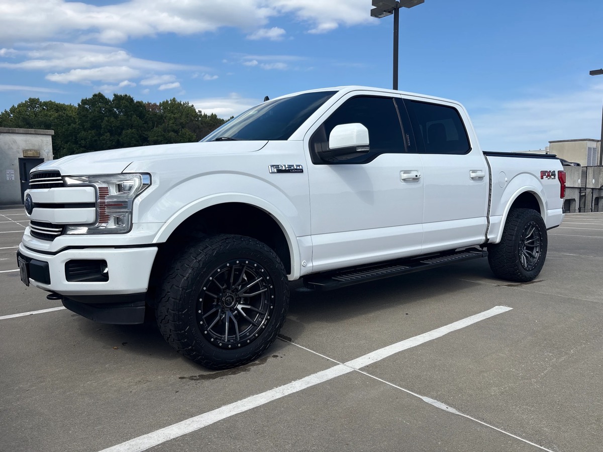 Lifted white Ford F-150 after a full detail